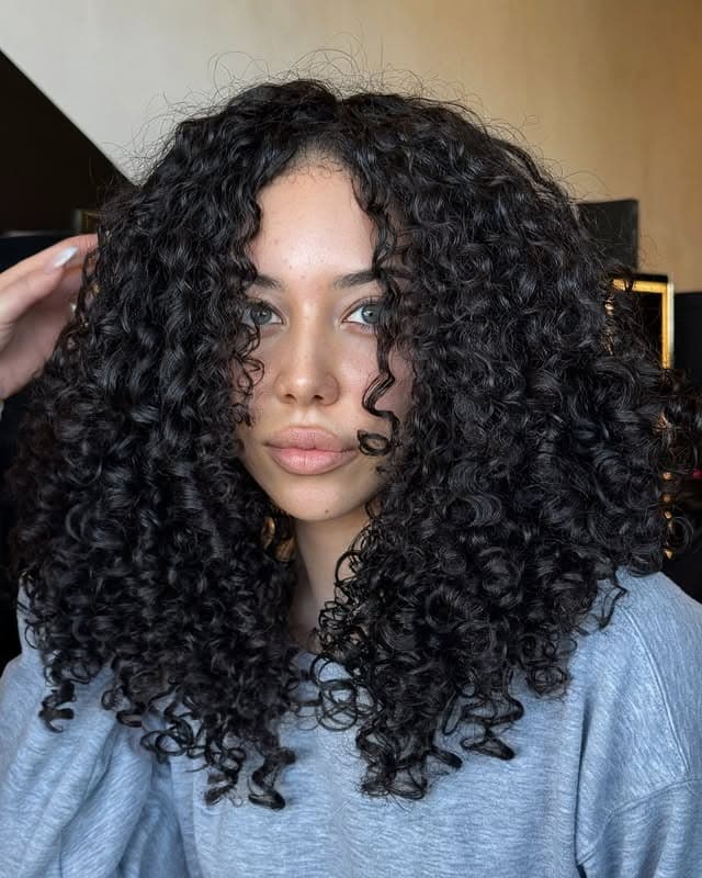 3. Defined Jet Black Curly Bob - Curly Hairstyles