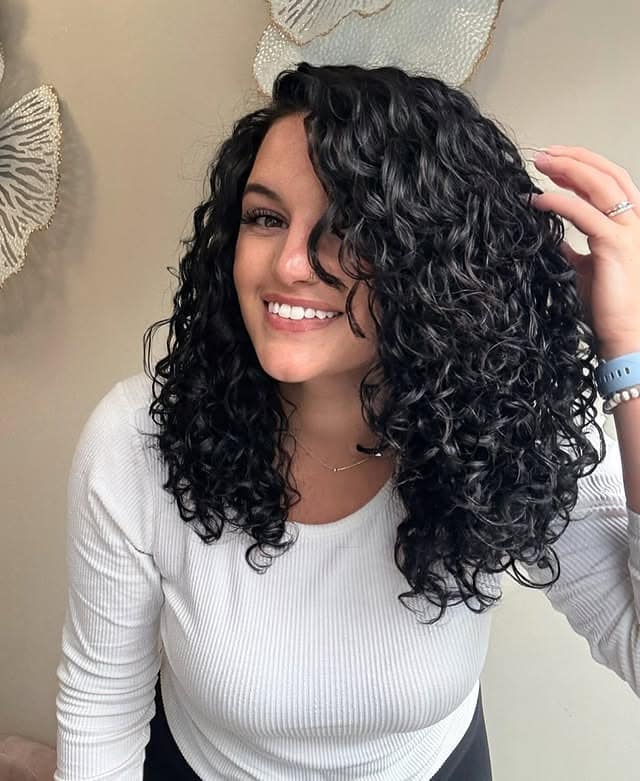 10. Jet Black Medium Curly Layers - Curly Hairstyles