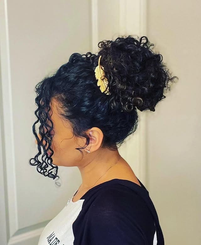 11. Curly Updo with Golden Leaf Accent - Curly Hairstyles