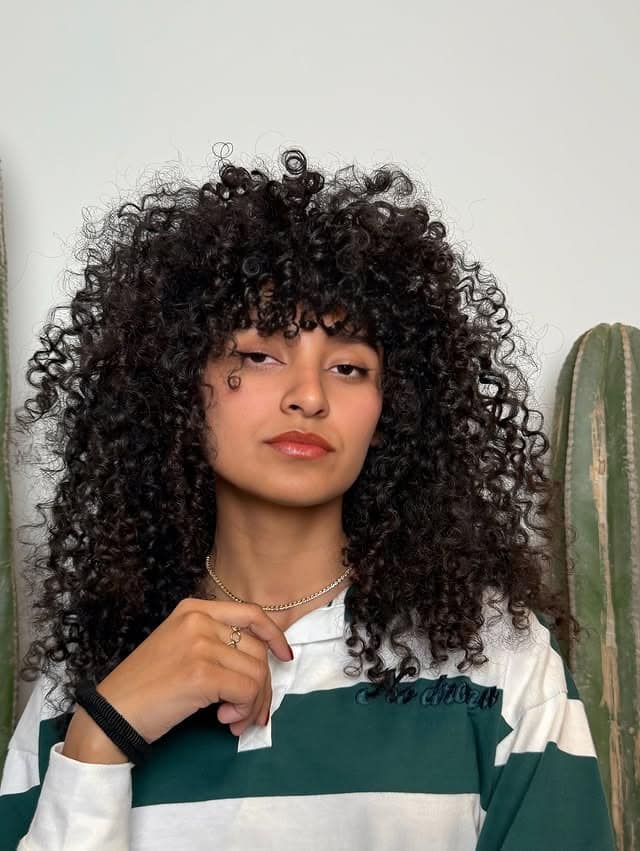 15. Curly Shag with Fringe - Curly Hairstyles