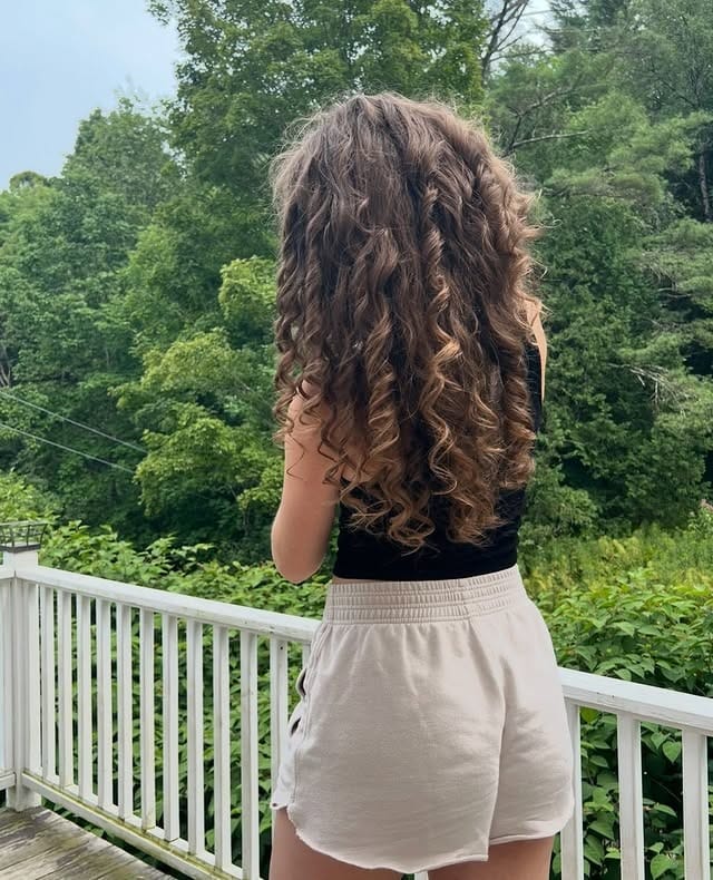 19. Golden Brown Spiral Cascade - Curly Hairstyles