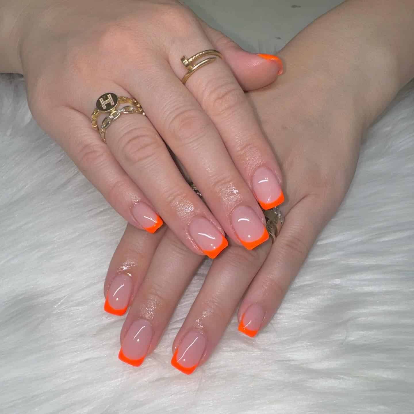 3. Square French Glow - neon orange nail ideas