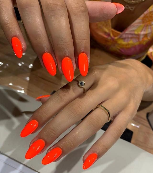 12. Glossy Almond Orange Glow - neon orange nail ideas