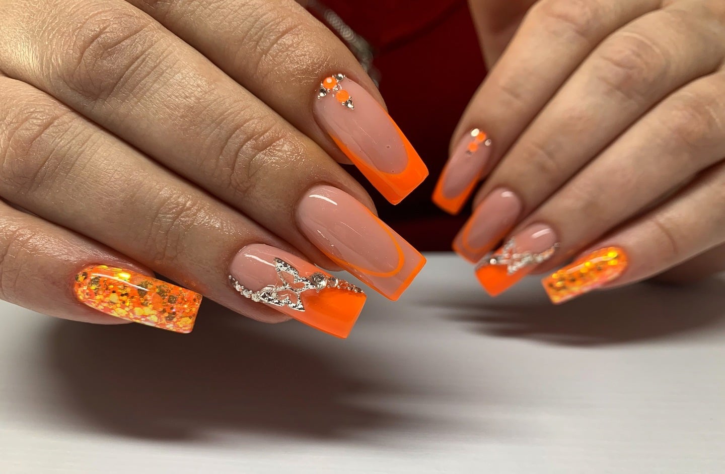 14. Butterfly Glam Orange Tips - neon orange nail ideas