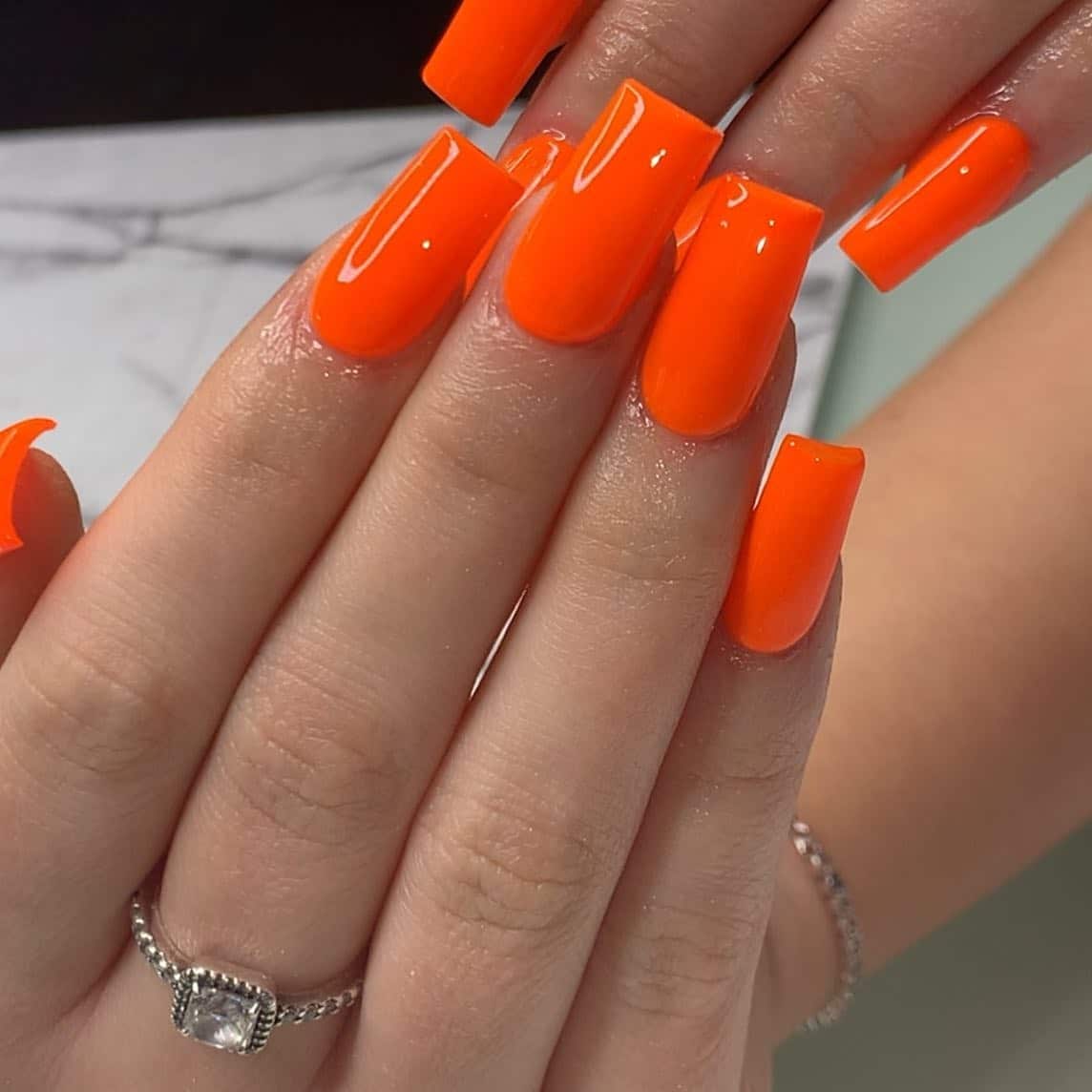20. Ultra Glossy Square Neon Finish - neon orange nail ideas