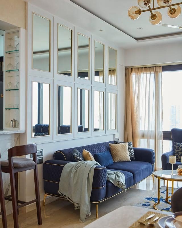 6. Urban Chic with Reflective Glamour - blue and gold living room ideas