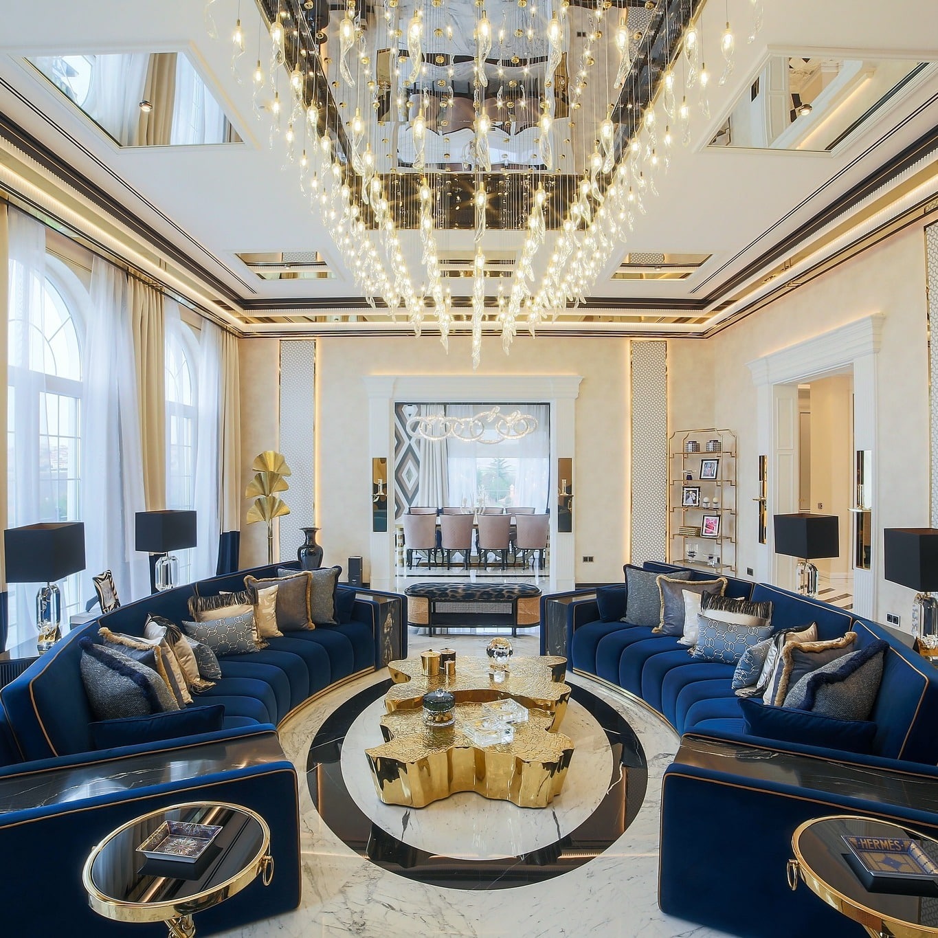 7. Grand Opulence with Architectural Drama - blue and gold living room ideas