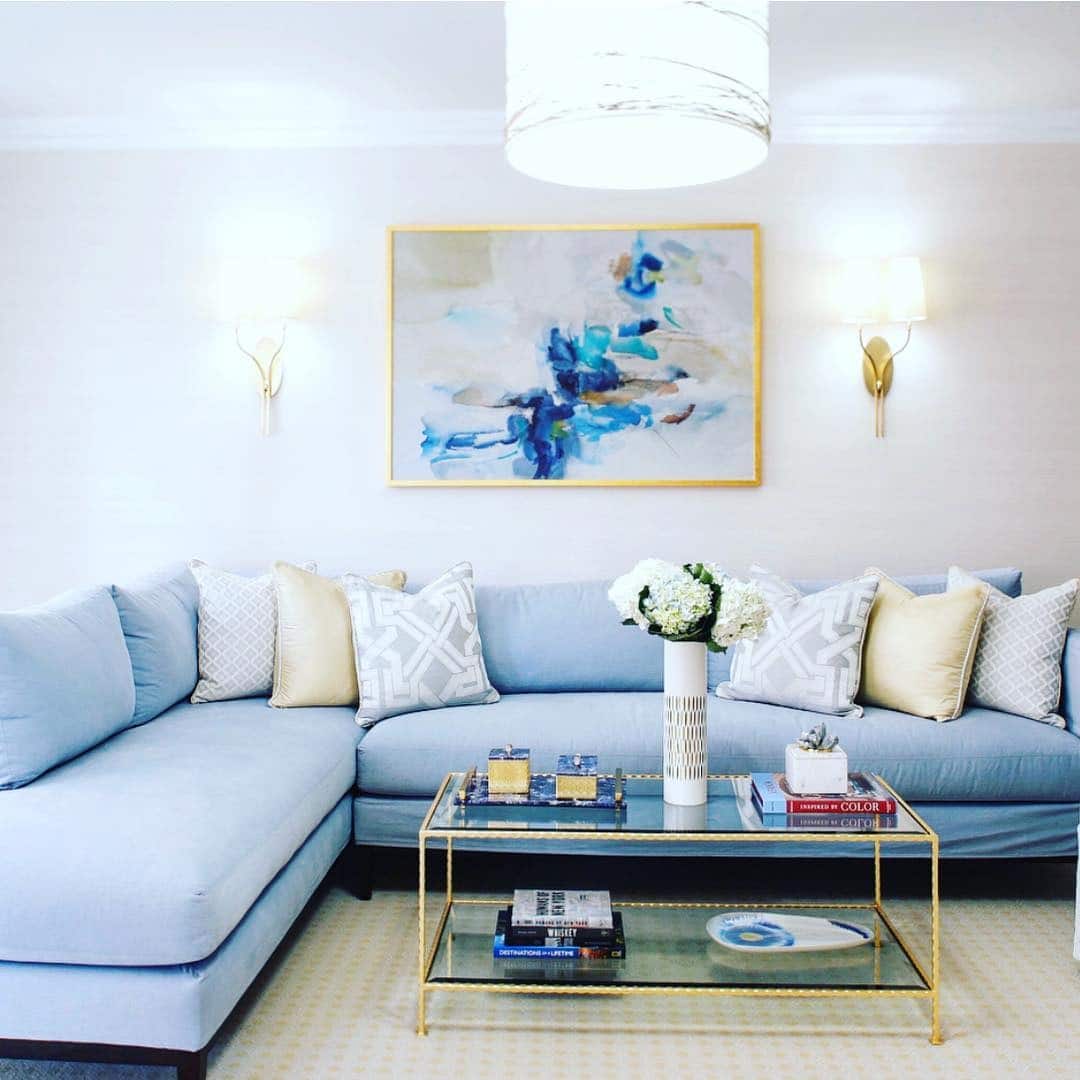 10. Coastal Modern with a Golden Touch - blue and gold living room ideas