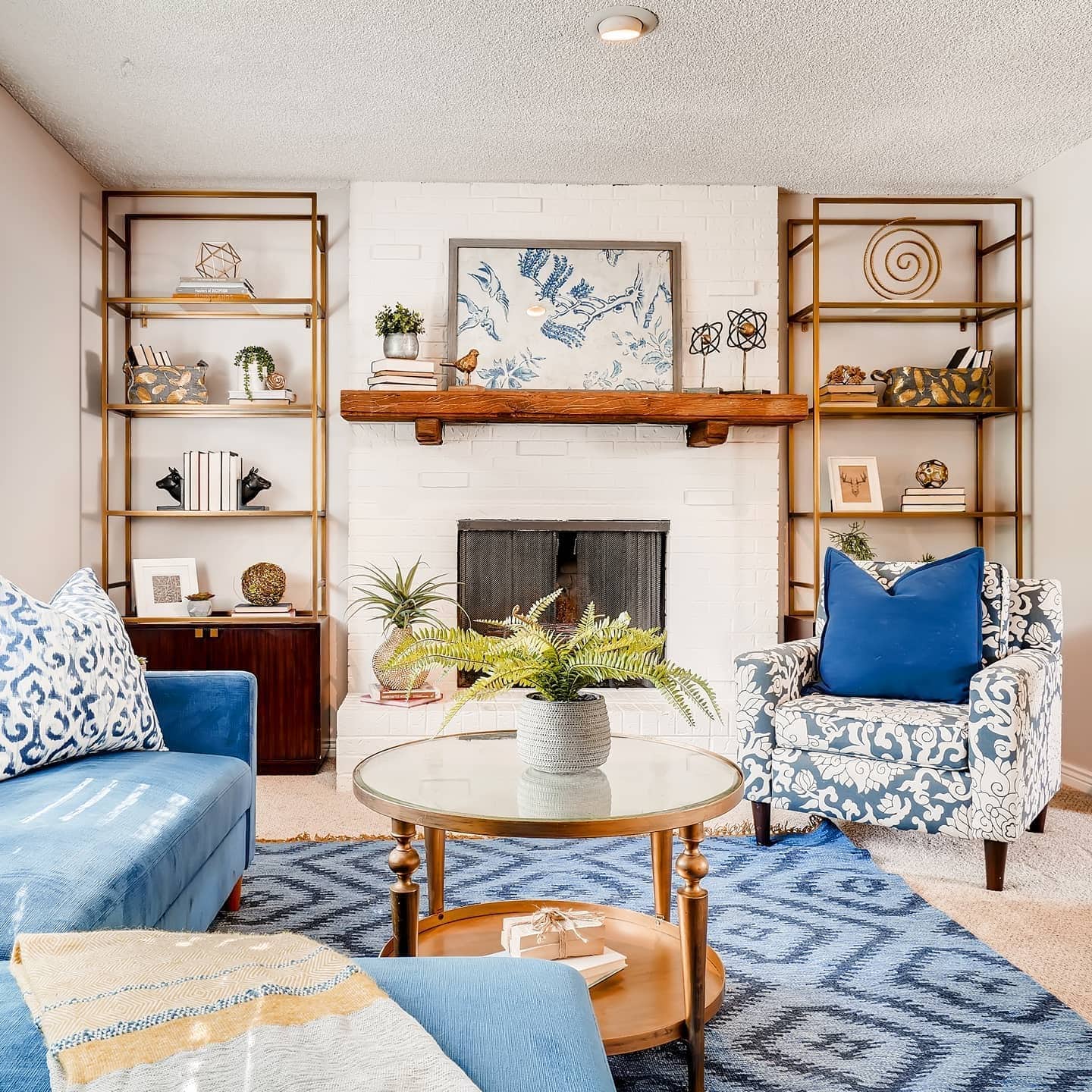 15. Eclectic Warmth in Blue and Brass - blue and gold living room ideas