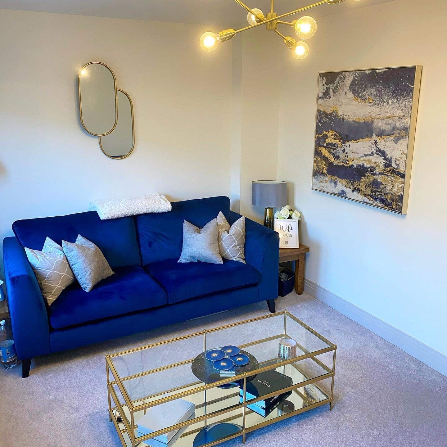 16. Contemporary Simplicity in Blue Velvet - blue and gold living room ideas