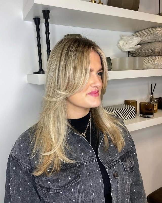 2. Layered Honey Blonde with Curtain Bangs - Honey Blonde Hair Color