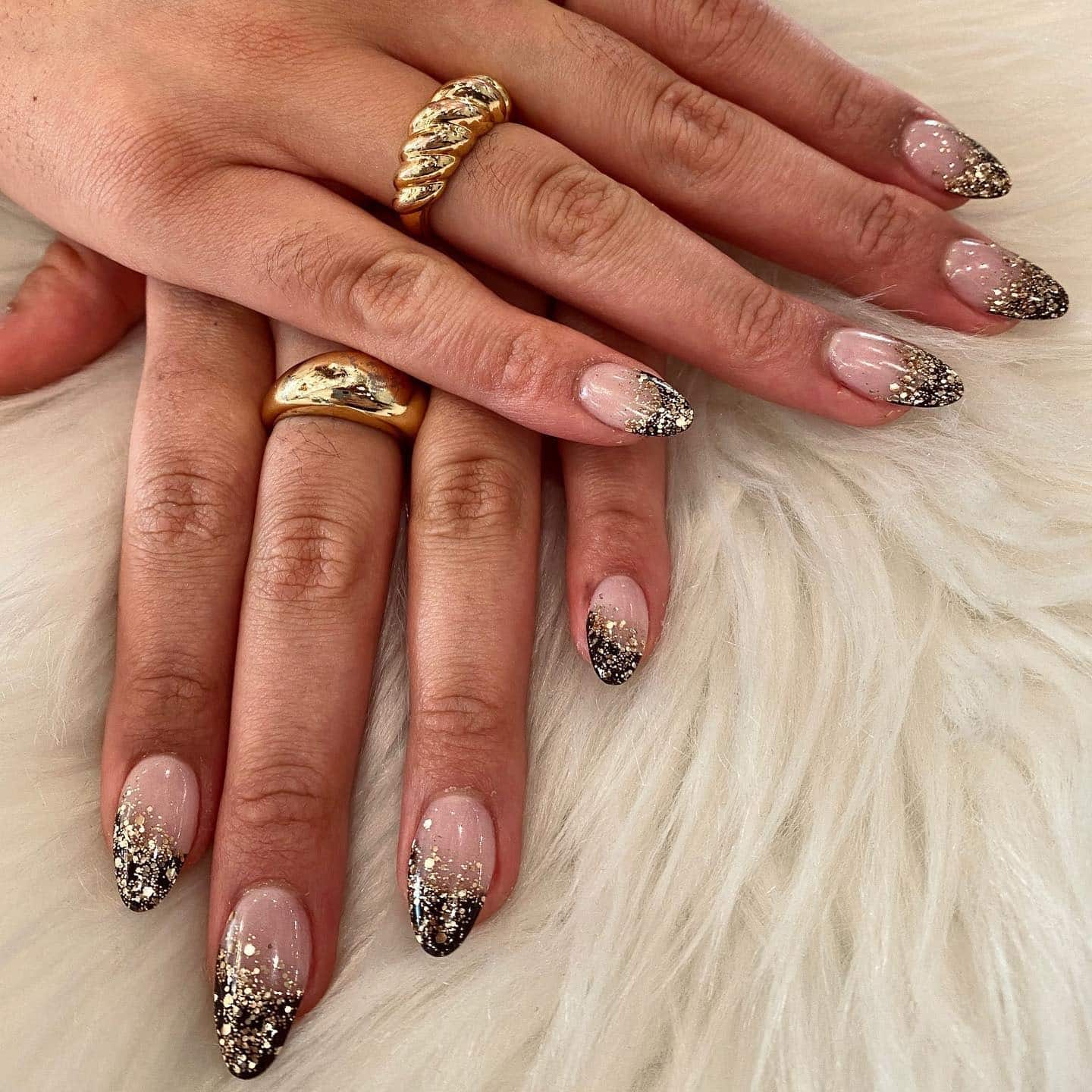 1. Champagne Glitter Fade – Gold and Nude Almond Nails - new years eve nail ideas