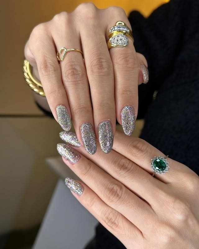 3. Diamond Dazzle – Silver Holographic Almond Nails - new years eve nail ideas