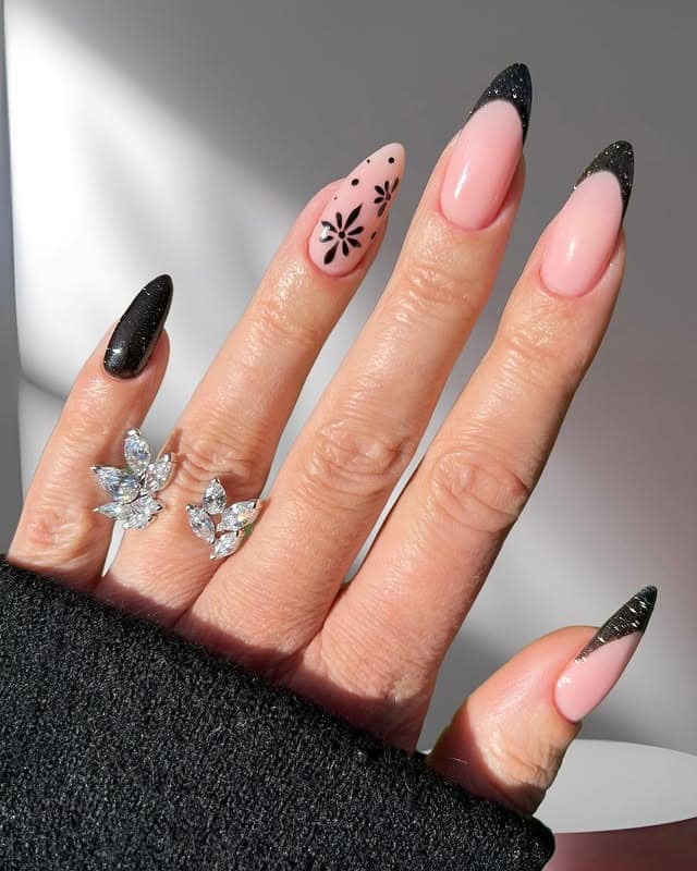 6. Midnight Bloom – Black and Pink Floral Almond Nails - new years eve nail ideas