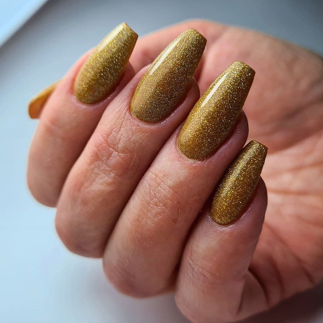 12. Golden Hour Glam – Metallic Gold Coffin Nails - new years eve nail ideas