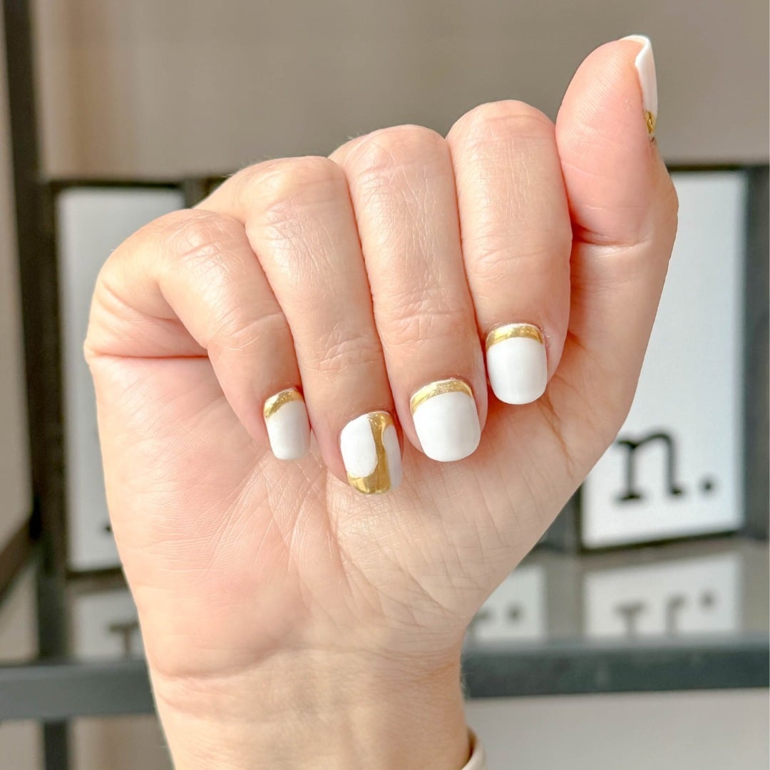 20. White Luxe – Gold-Trimmed Short Nails - new years eve nail ideas