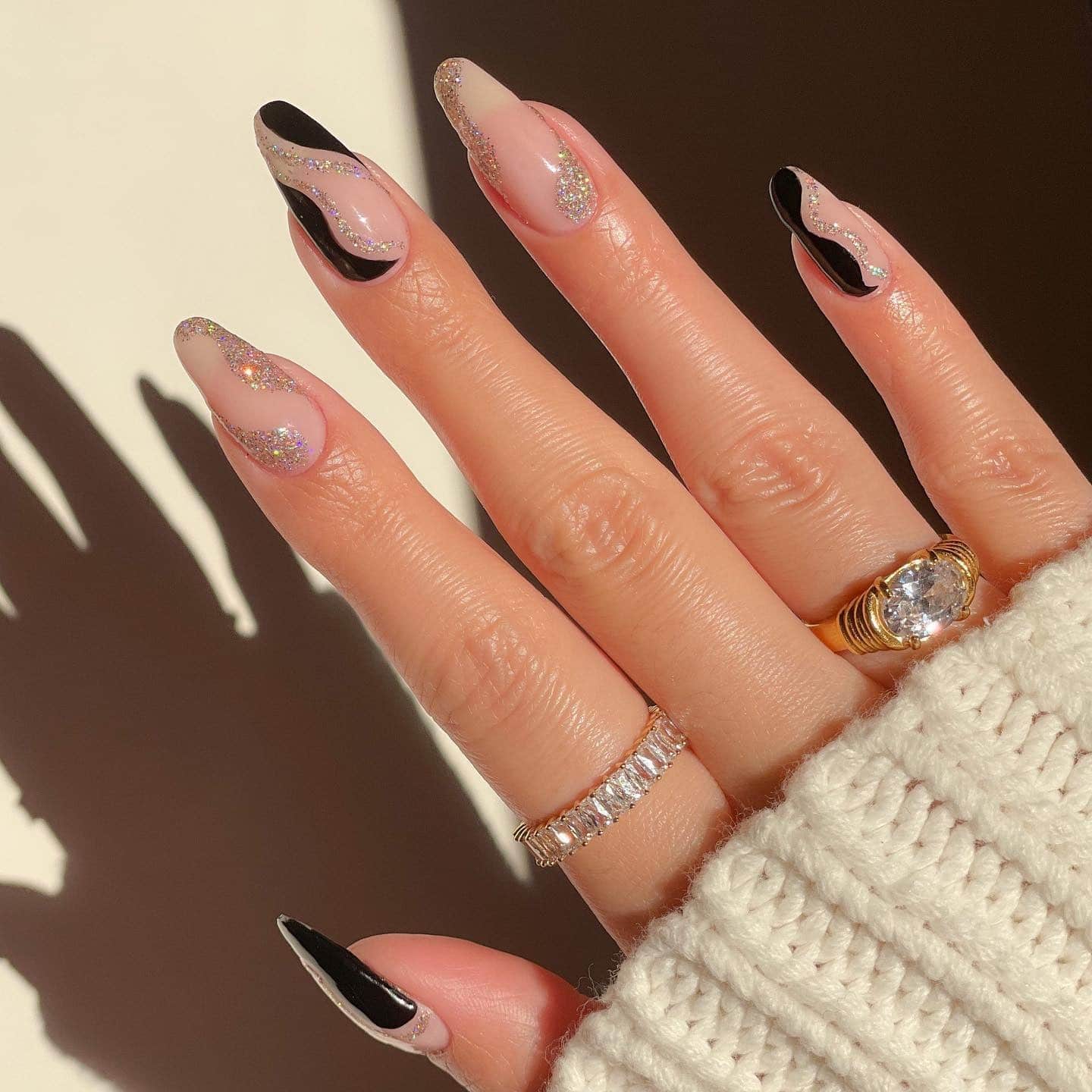 22. Glam Wave – Black and Silver Abstract Nails - new years eve nail ideas