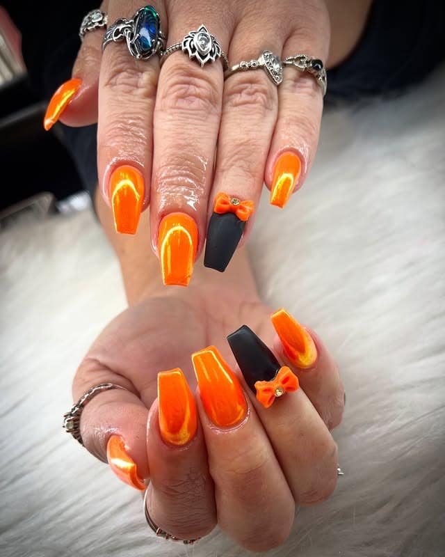 1. Neon Ember Elegance - orange and black nail ideas