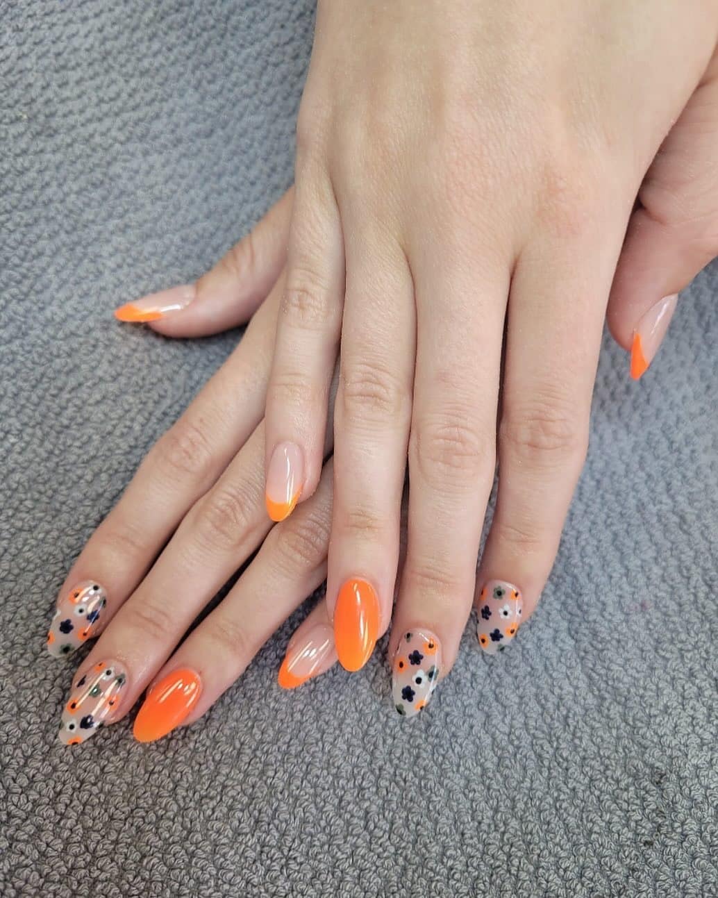 3. Citrus Bloom Delight - orange and black nail ideas