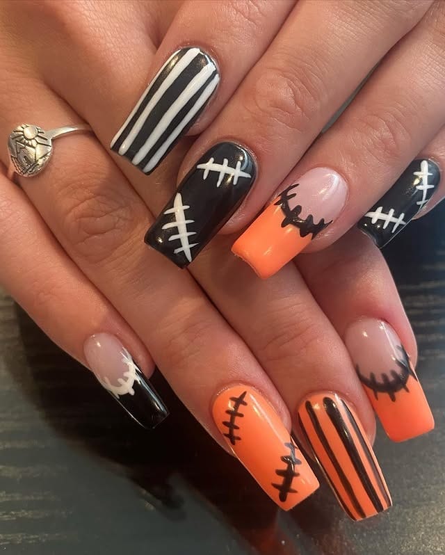 5. Patchwork Halloween Chic - orange and black nail ideas