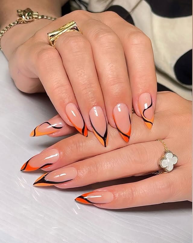19. Twilight Flame Tips - orange and black nail ideas