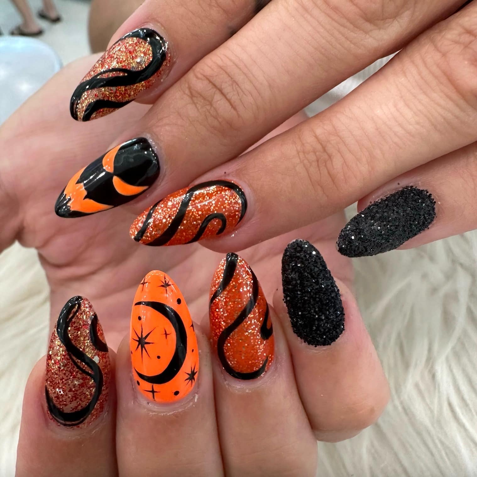 22. Glitter Eclipse Magic - orange and black nail ideas