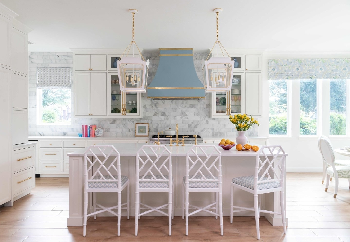 2. Soft Glamour with a Touch of Blue - backsplash ideas for white kitchen