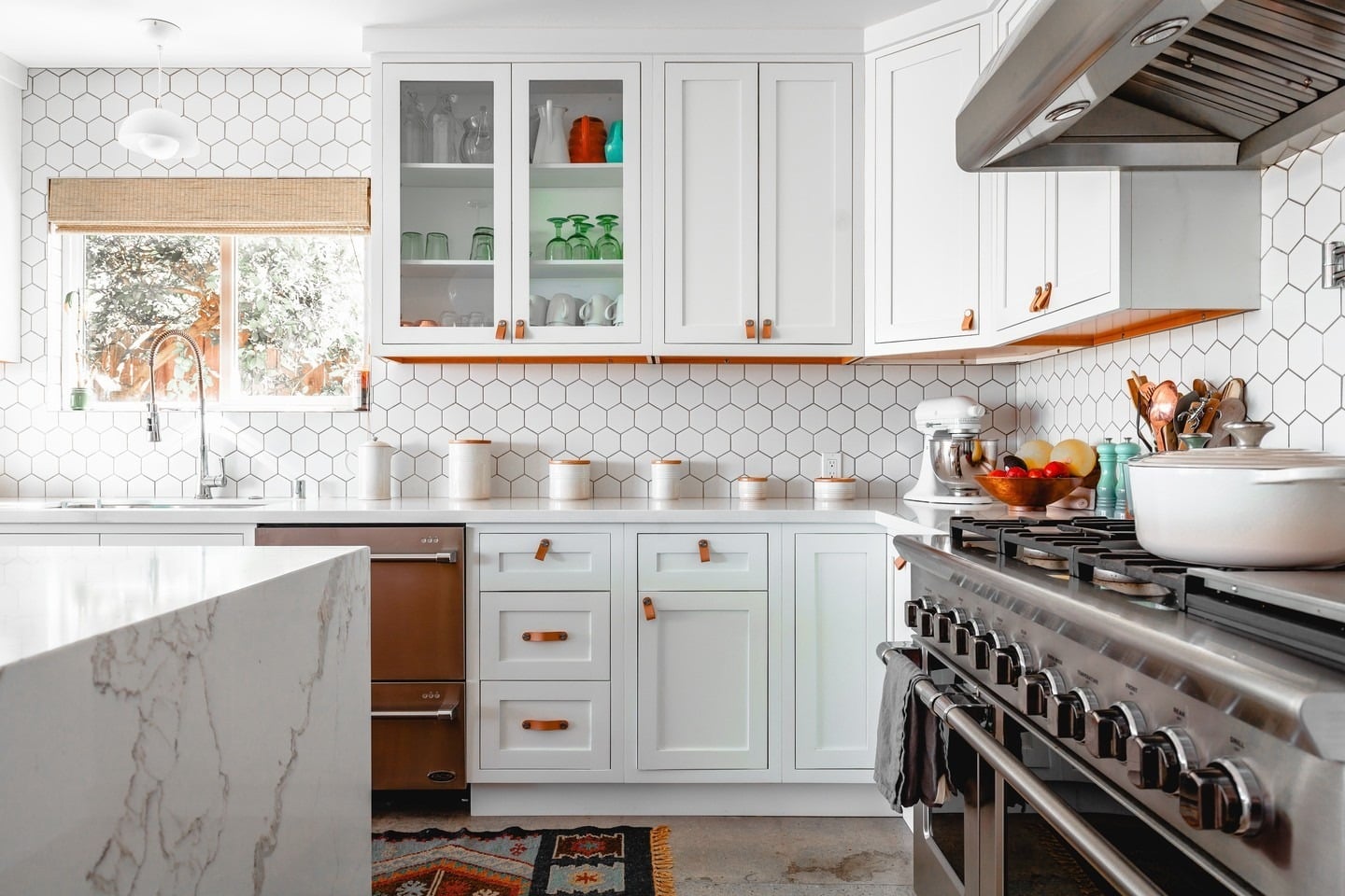 5. Bright Geometry with Leather Details - backsplash ideas for white kitchen