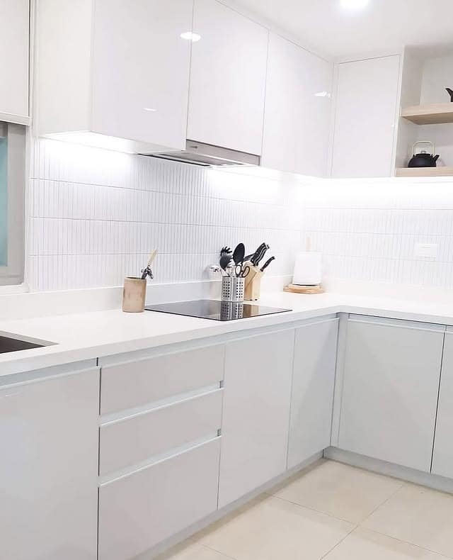 12. Streamlined All-White Precision - backsplash ideas for white kitchen