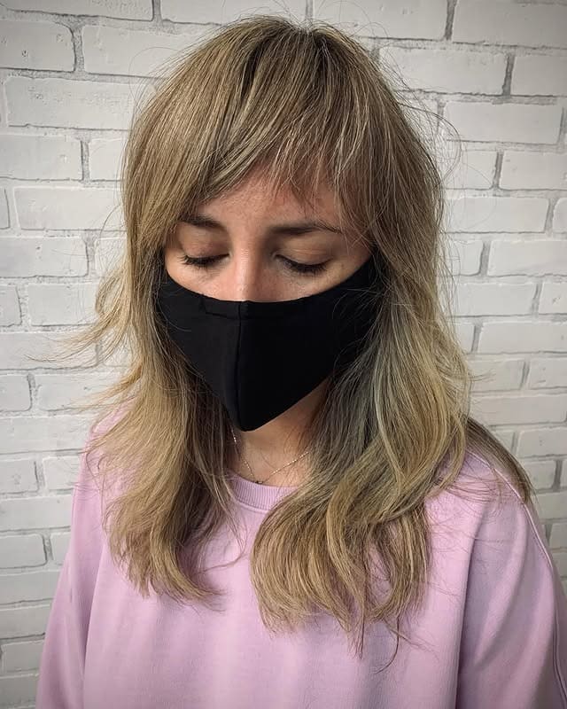 3. Smoky Ash Shag with Feathered Bangs - Asymmetrical Bangs Hairstyles