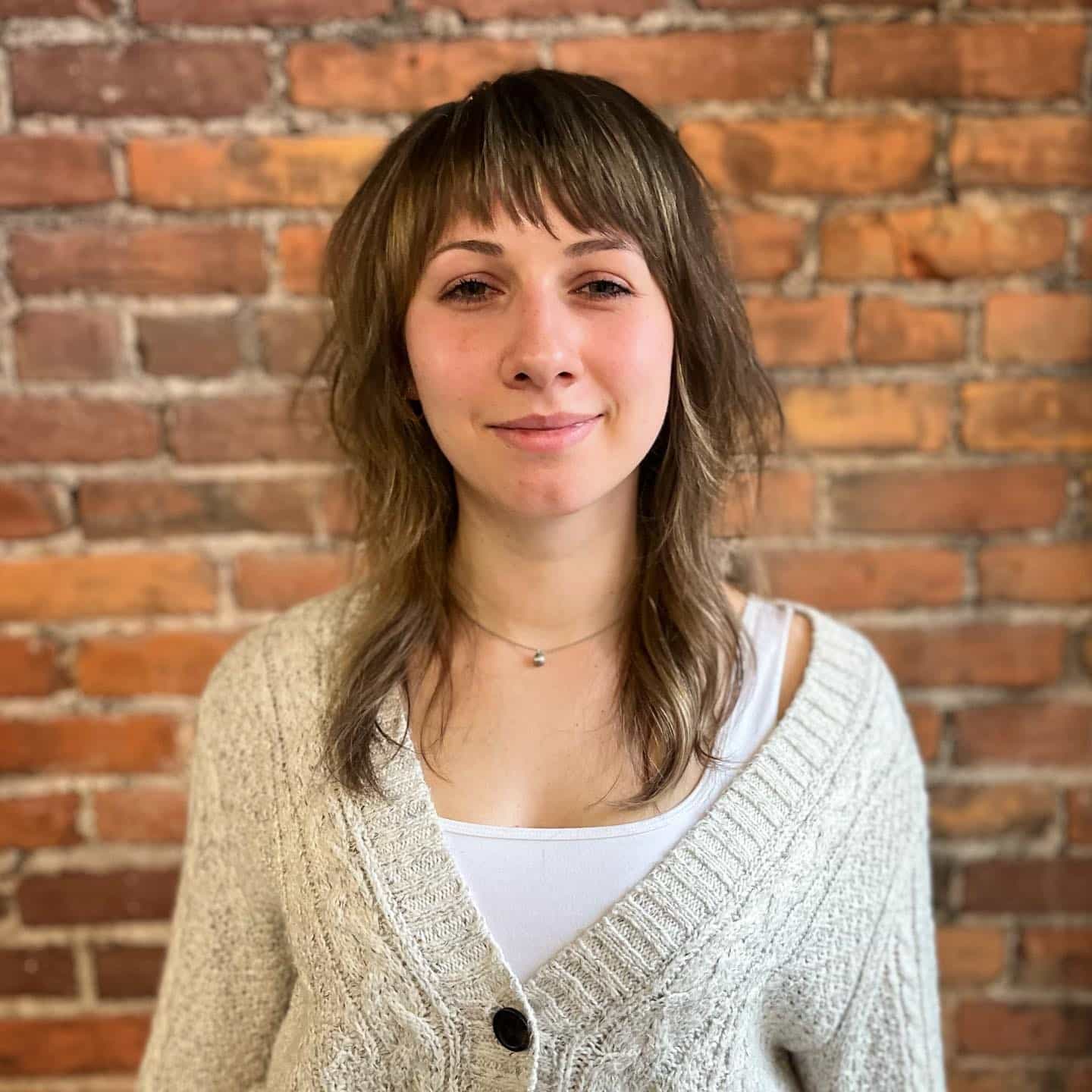 7. Bronzed Wolf Cut with Wispy Asymmetrical Fringe - Asymmetrical Bangs Hairstyles