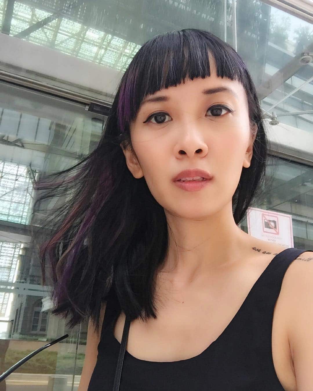 19. Raven Shoulder-Length Cut with Violet Accent and Uneven Fringe - Asymmetrical Bangs Hairstyles