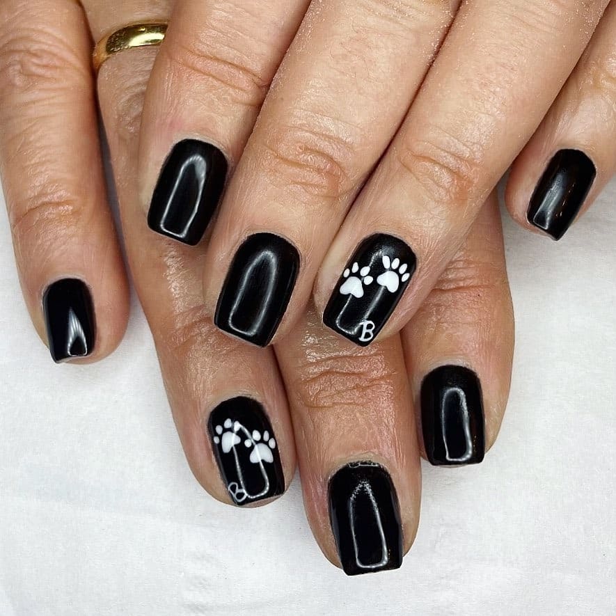 3. Minimal Monochrome Paw Accent - paw print nail ideas