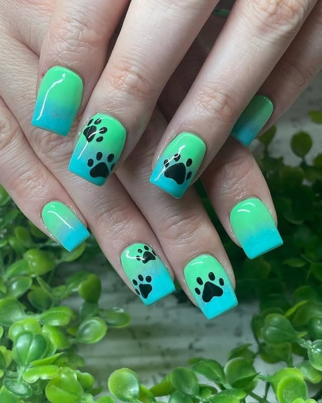 4. Aqua Gradient with Black Paws - paw print nail ideas