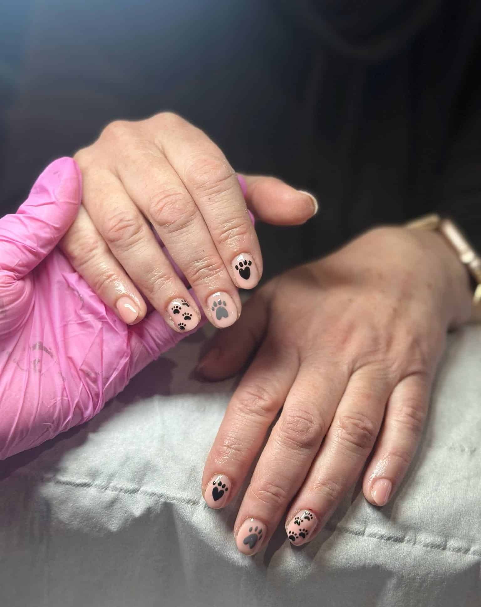 5. Soft Nude with Matte Black Paws - paw print nail ideas