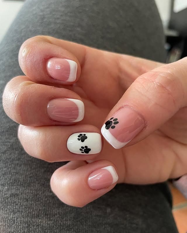 6. Classic French with Paw Detail - paw print nail ideas
