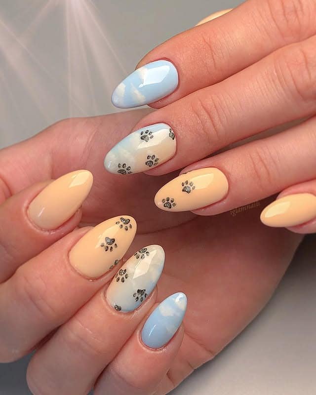 8. Sunset Sky Paw Trail - paw print nail ideas