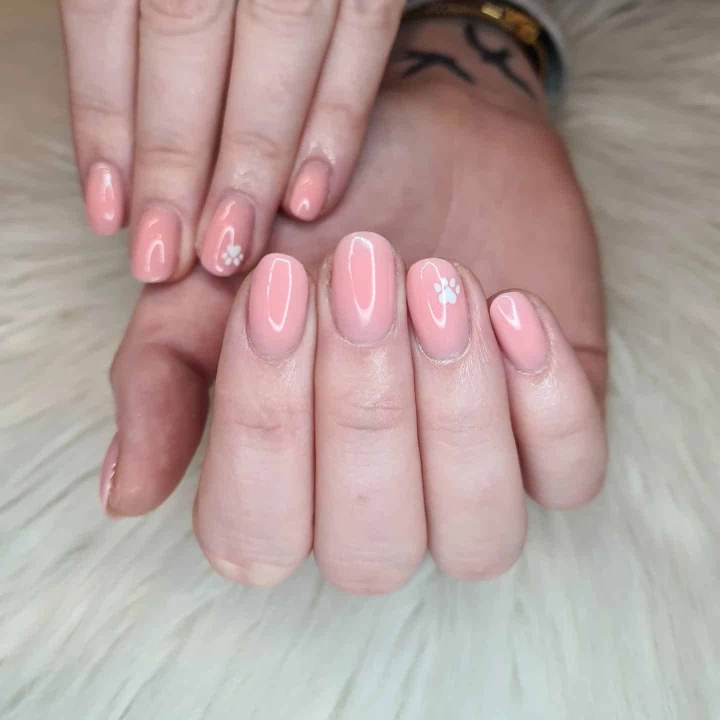 9. Peachy Gloss with Subtle Paw Touch - paw print nail ideas