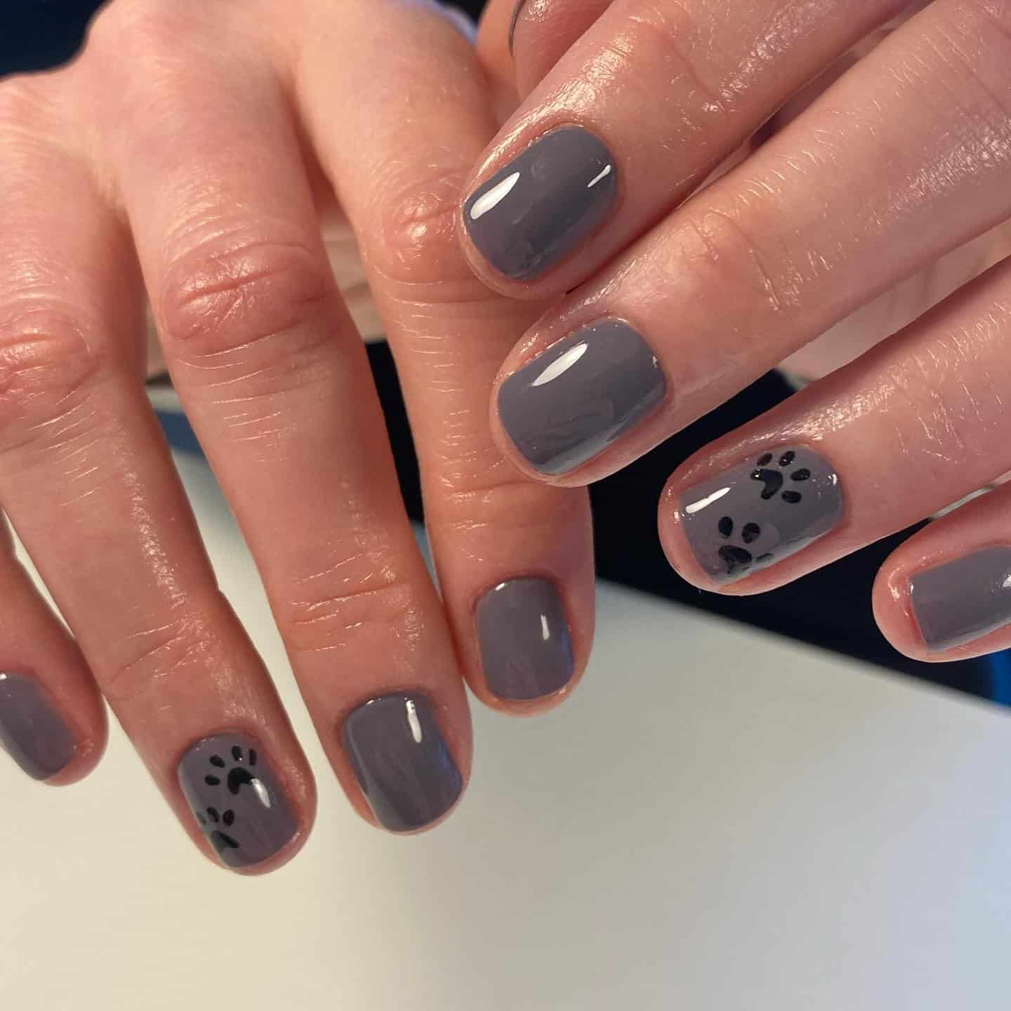 13. Dusty Gray Paw Simplicity - paw print nail ideas