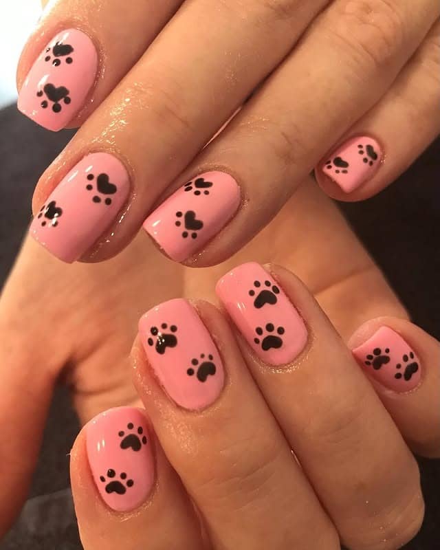 14. Bubblegum Pink Paw Parade - paw print nail ideas
