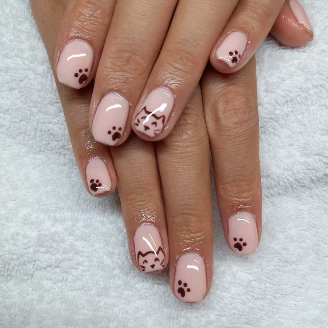 16. Soft Pink Kitty Charm - paw print nail ideas