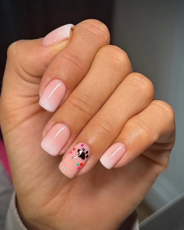 17. Pastel Ombre with Confetti Paw Accent - paw print nail ideas