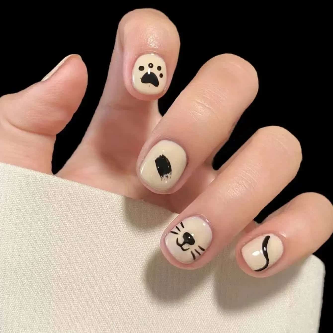 19. Minimal Cat-Inspired Beige Design - paw print nail ideas