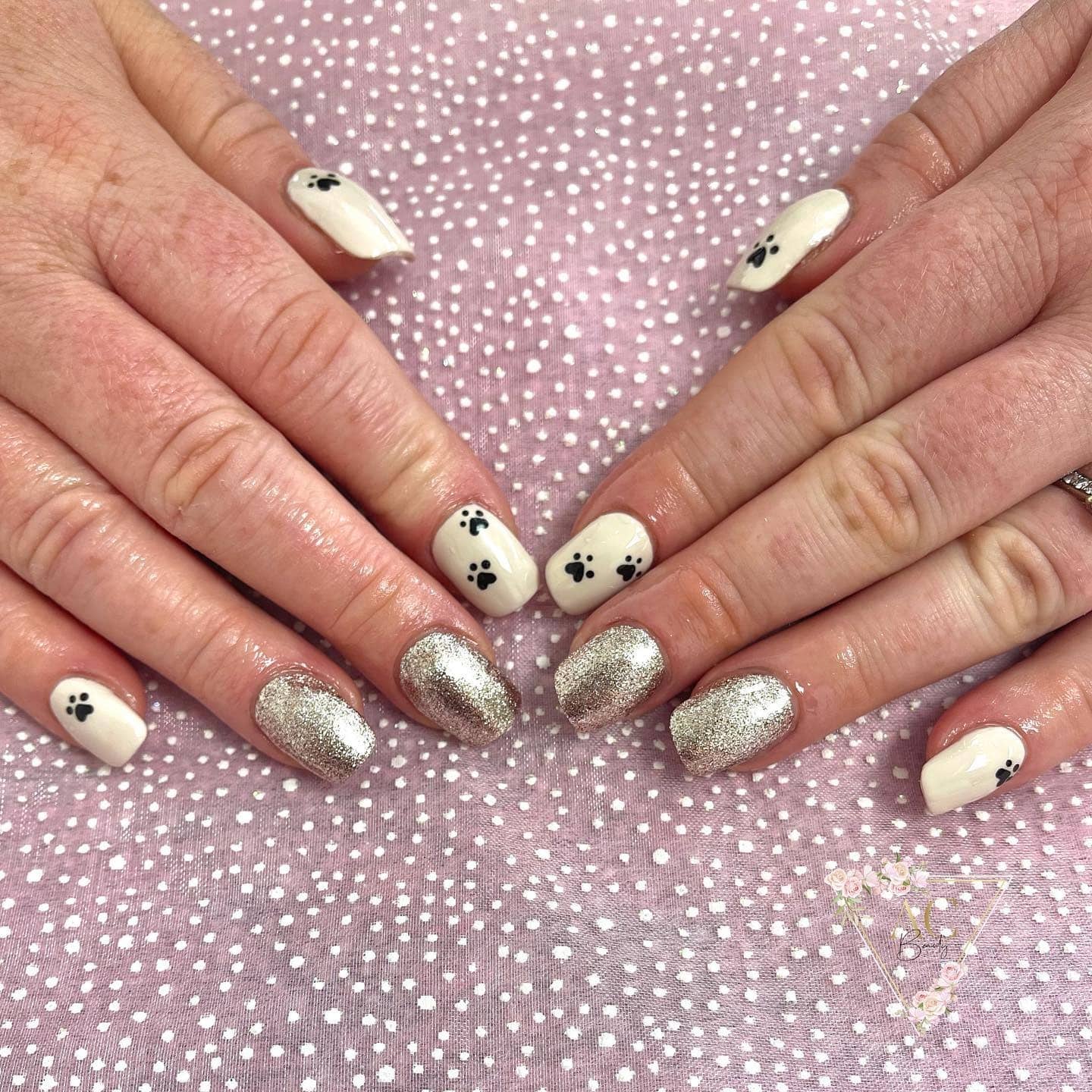 20. Silver Sparkle and Cream Paw Mix - paw print nail ideas