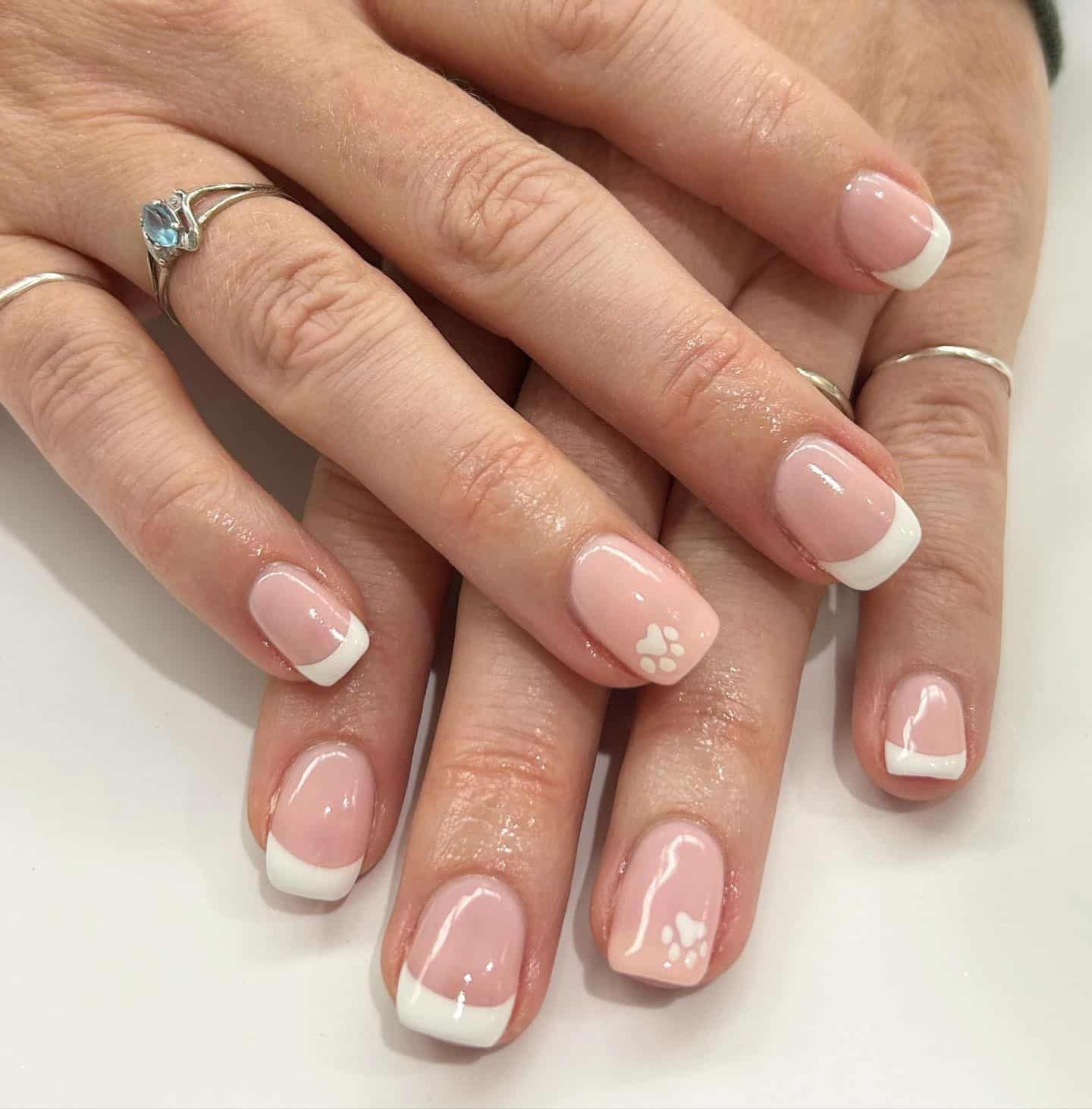 21. Classic French with Subtle Paw Detail - paw print nail ideas