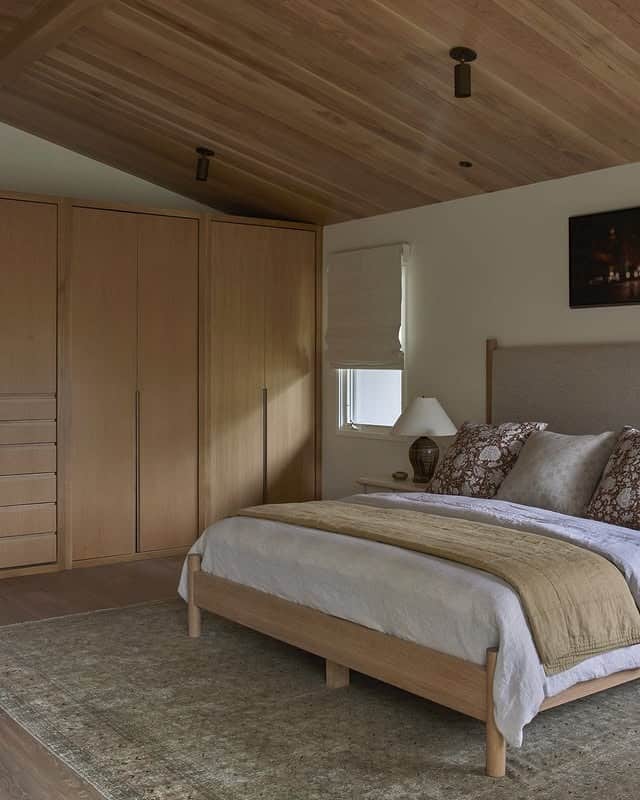 6. Warm Timber Serenity with Earthy Neutrals - blank wall bedroom ideas