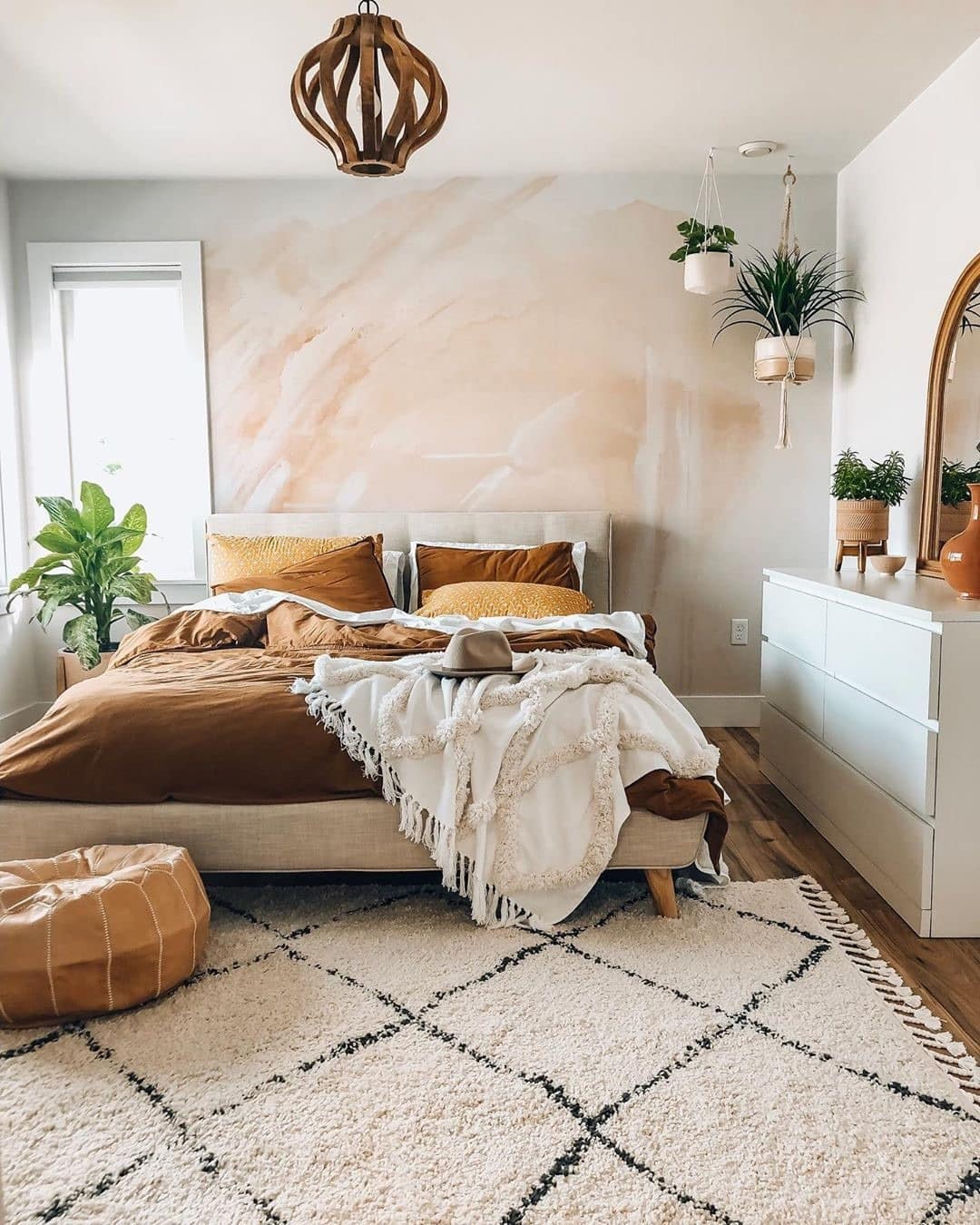 7. Sunlit Bohemian Warmth with Terracotta Accents - blank wall bedroom ideas