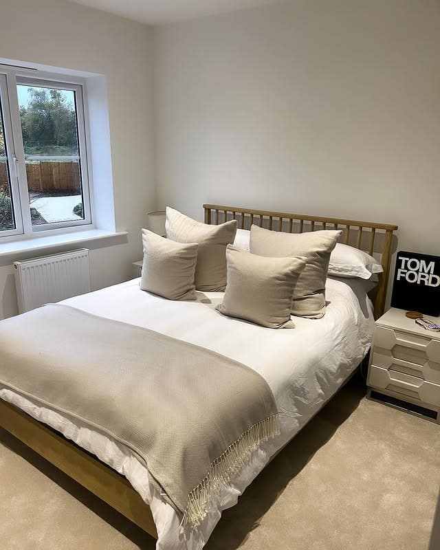 9. Minimal Modern Comfort in Cream and Sand - blank wall bedroom ideas