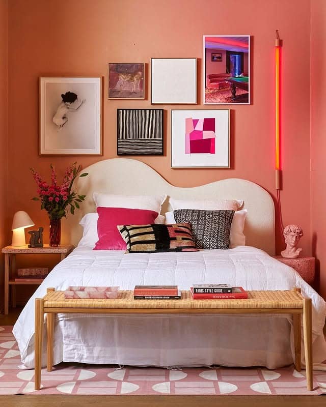 15. Playful Art Wall in Coral and Blush - blank wall bedroom ideas