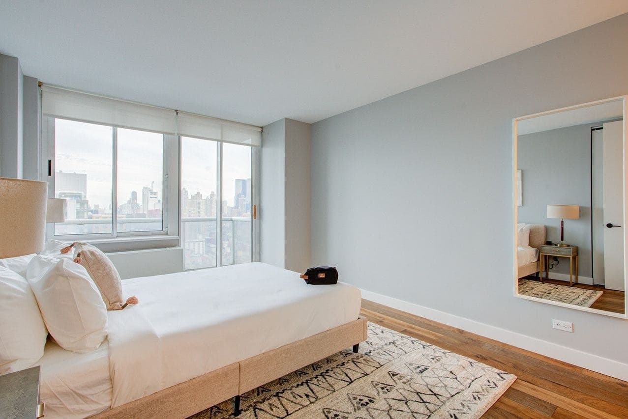 19. Skyline Simplicity in Pale Grey - blank wall bedroom ideas